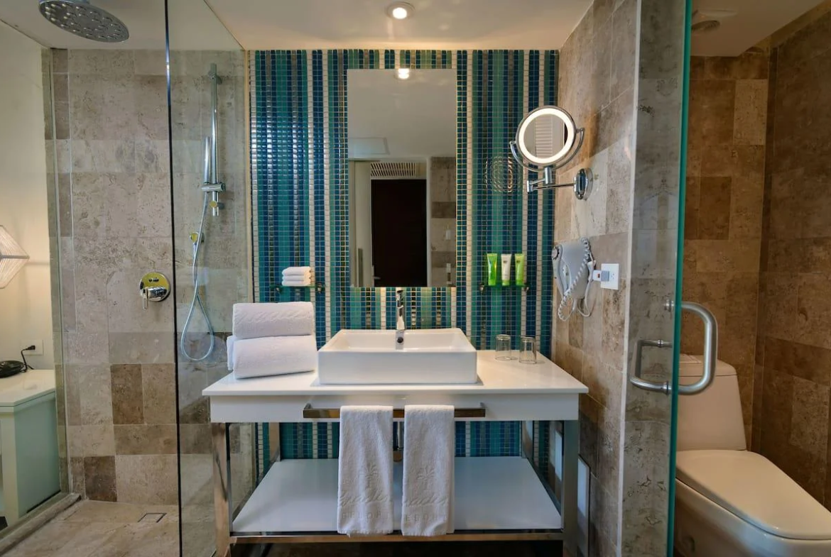 Open-plan bathroom with rain shower