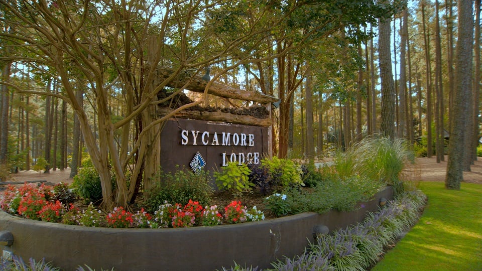Travel Resorts Sycamore Lodge RV Resort sign