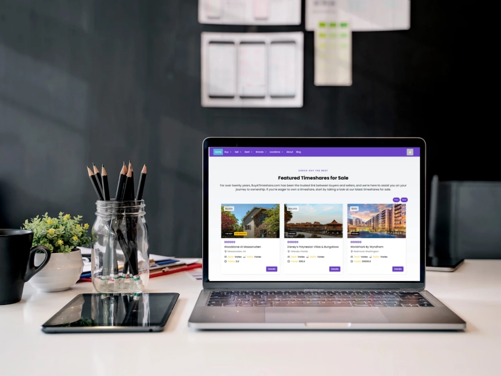 Laptop displaying featured timeshare ads for Woodstone at Massanutten, Disney's Polynesian, and Worldmark resorts.