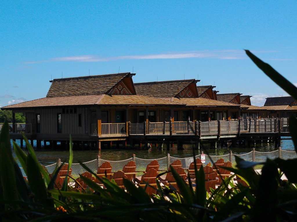 Over-the-water bungalows with traditional thatched roofs and private decks at Disney's Polynesian Village Resort. Difference Between Points and Weeks Timeshare