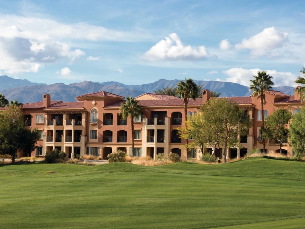Scenic exterior view of Marriott's Shadow Ridge Villages overlooking a lush green golf course and distant mountains.