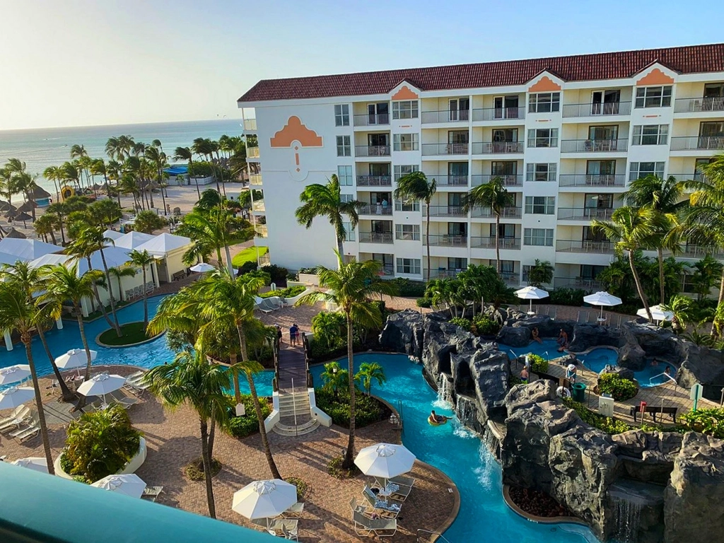 Courtyard pool with rock waterfalls and lounge chairs at a Caribbean timeshare, Marriott's Aruba Ocean Club.