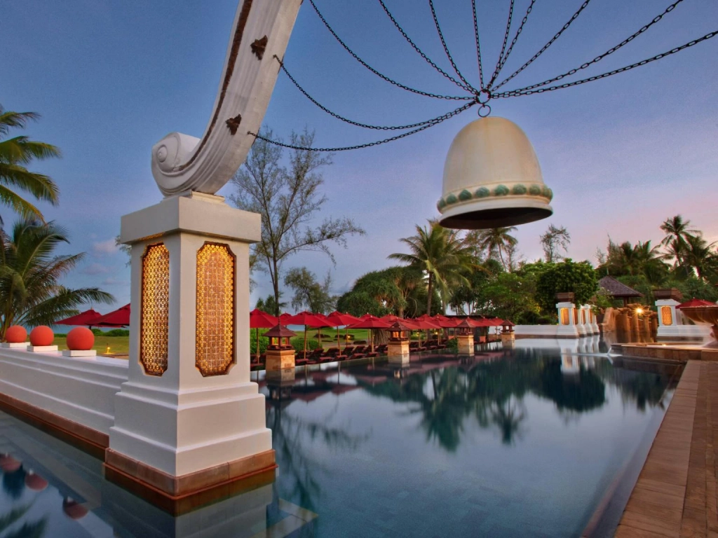 Explore how does Marriott timeshare work beside the elegant pool and decorative bell at Marriott's Phuket Beach Club.