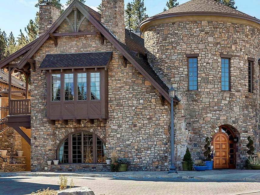 Stone lodge exterior of The Club at Big Bear Village, ideal for buyers exploring the timeshare resale market.