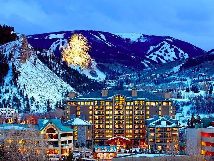 Fireworks over the snow-covered mountains behind The Westin Riverfront, a prime spot in the timeshare resale market.
