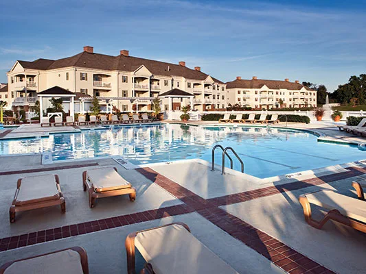 Sunny Wyndham timeshare resort pool, helping owners research how much they can sell their timeshare for.